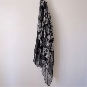 Women’s black and white crystal and floral skull scarf.